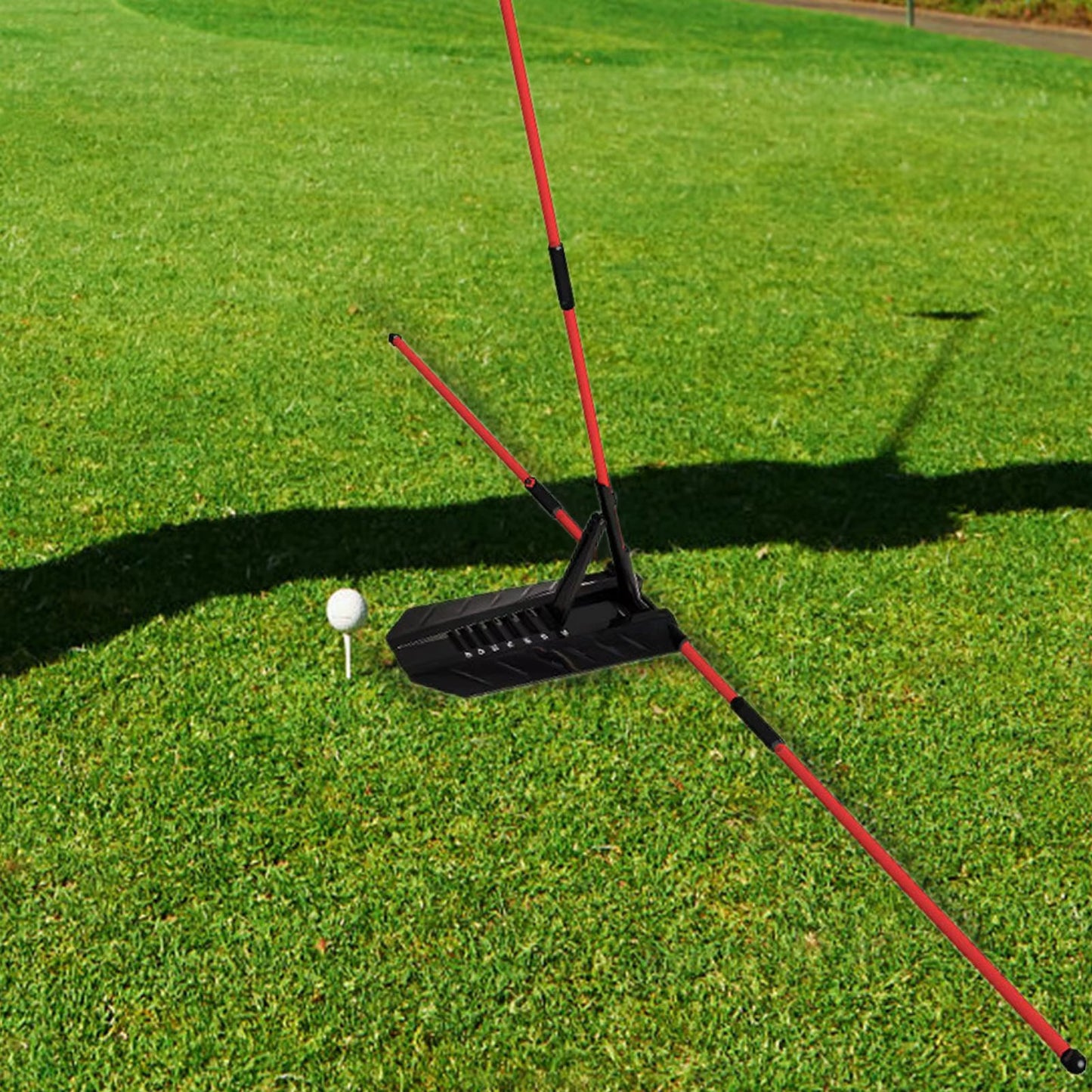 Golf practice device on a green grass field