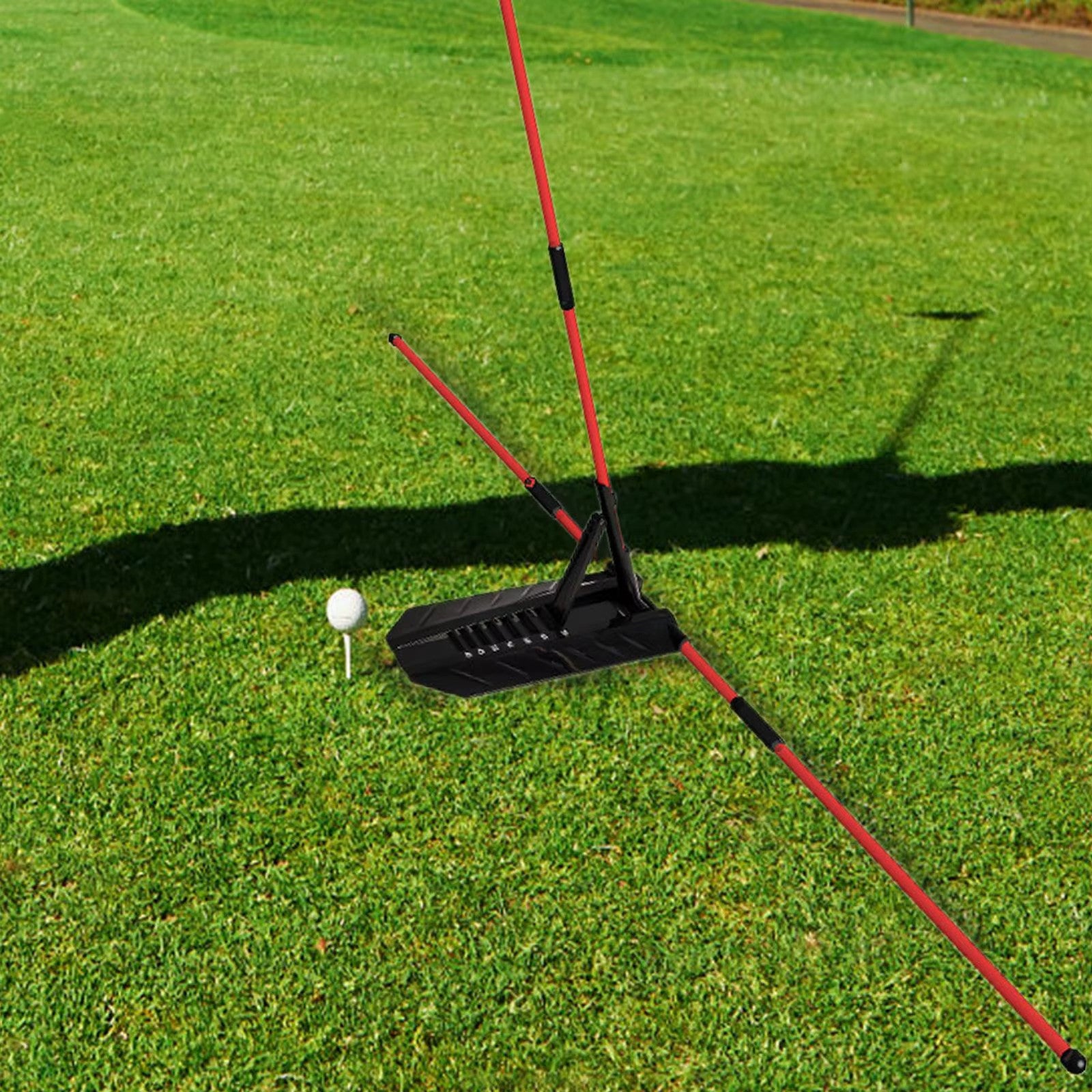 Golf practice device on a green grass field