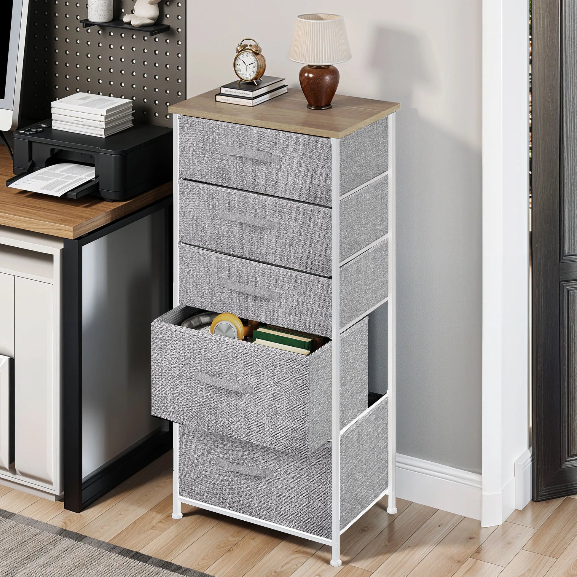 Gray storage tower with multiple drawers in a home office setting