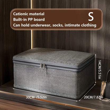 Gray storage box with text on a wooden background