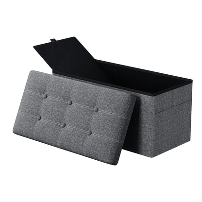 Gray fabric storage bench with open lid on a white background