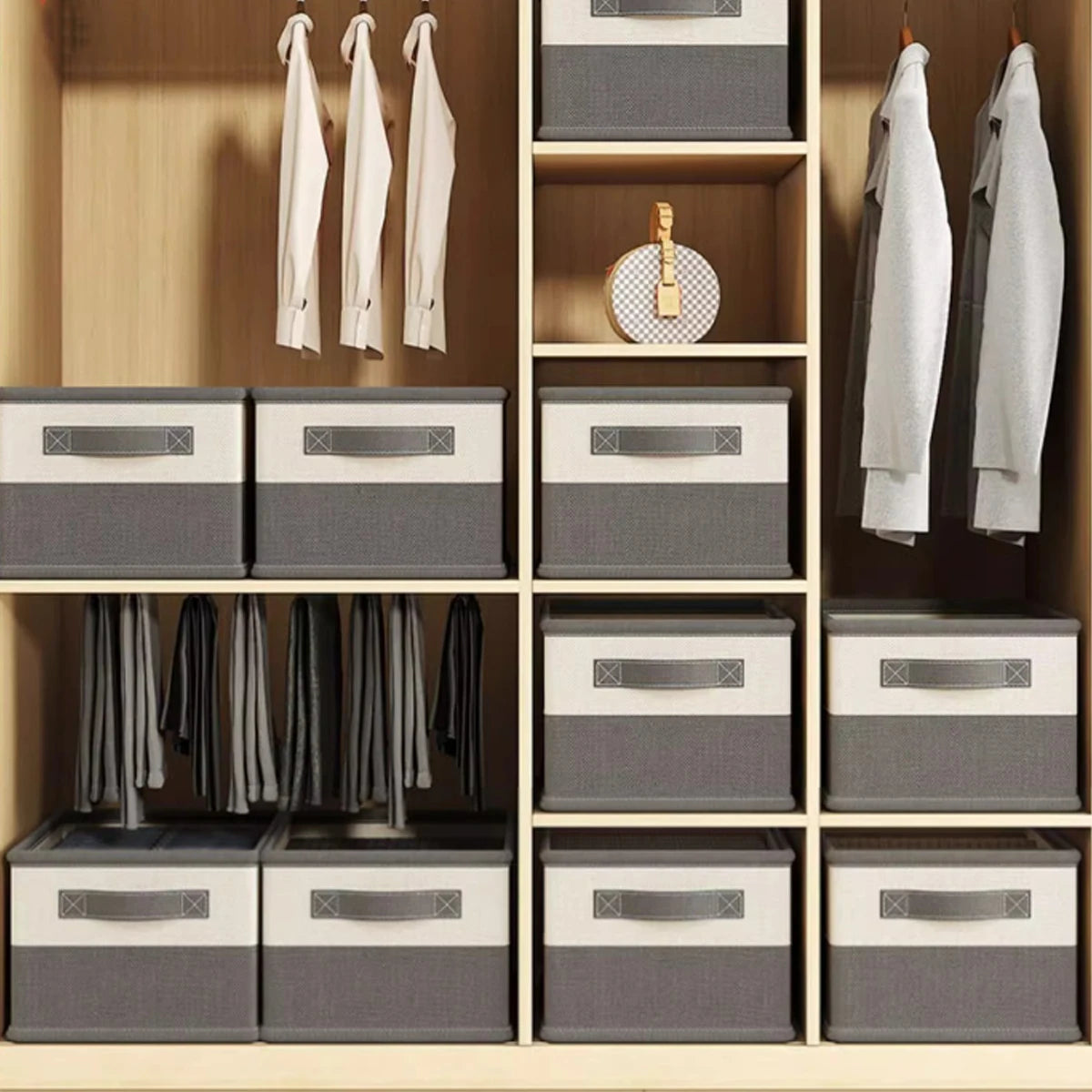 Closet with wooden shelves and gray storage boxes, clothes hanging on hooks.