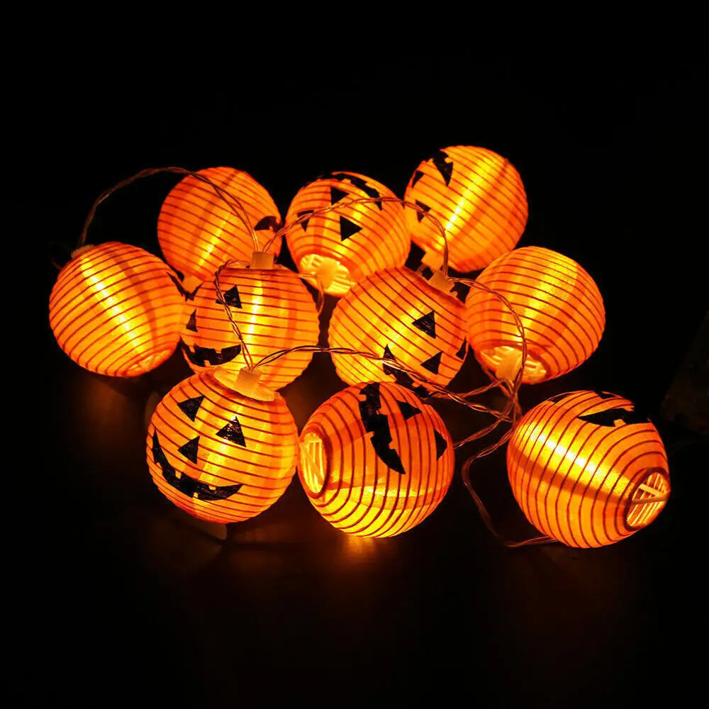 String of Halloween-themed lantern lights on a black background