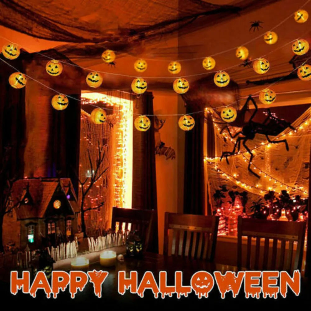 Halloween-themed room with string lights, pumpkins, and cobwebs with 'Happy Halloween' text.