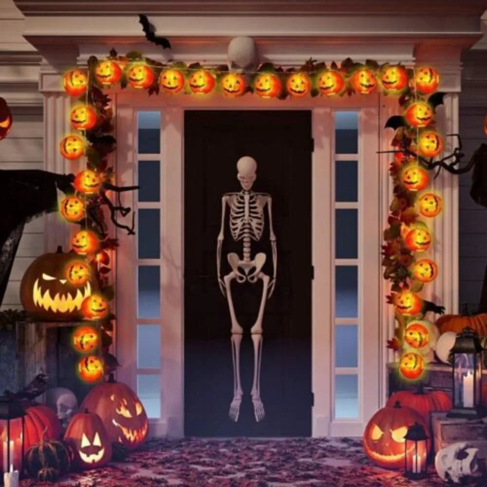 Halloween-themed door with jack-o'-lanterns and a skeleton