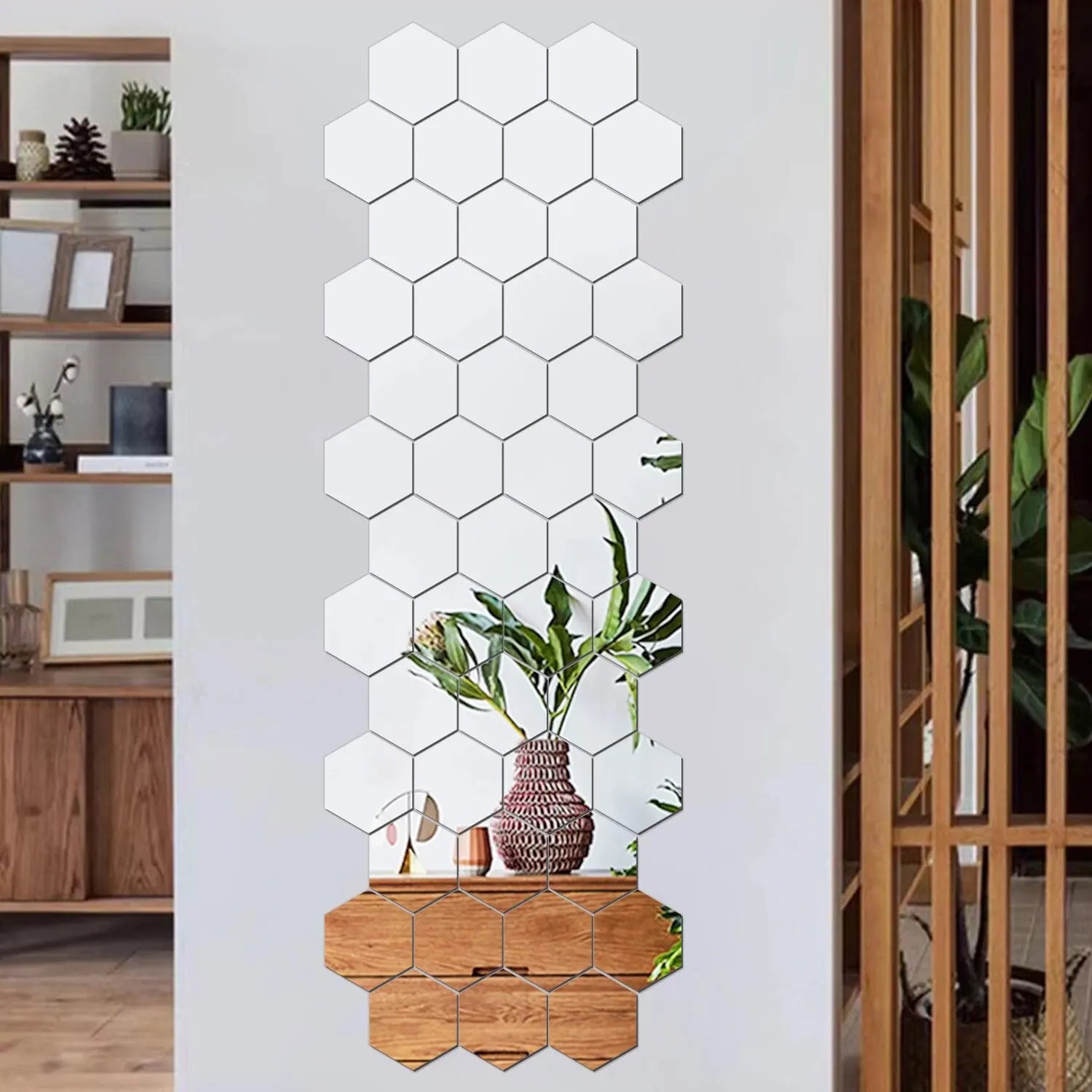 Hexagonal mirror wall decal on a white wall with a room in the background