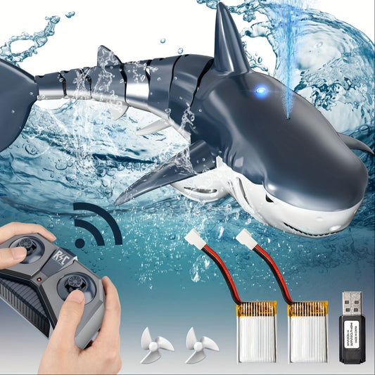 Toy shark with remote control, batteries, and USB cable on a water-themed background