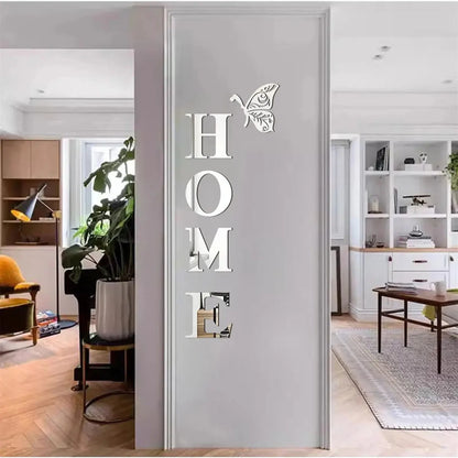 Decorative mirror with 'HOME' and butterfly design on a wall in a modern living room.