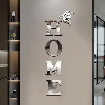 Decorative wall art with 'HOME' letters and a logo on a neutral wall.
