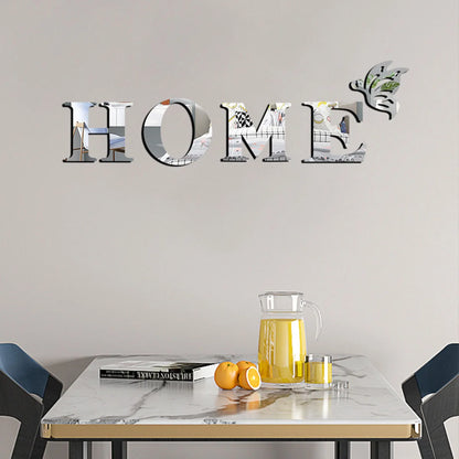 Decorative 'HOME' wall letters on a neutral wall with a table and chairs below.