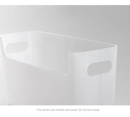 Clear plastic storage box with rounded corners on a gray background