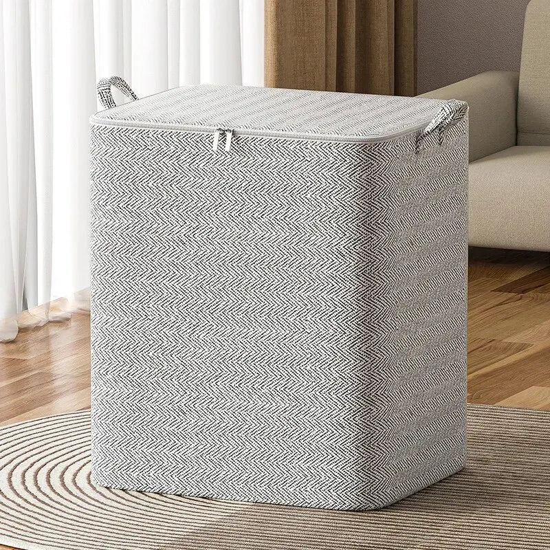 Gray and white striped laundry basket on a wooden floor with a neutral-colored sofa in the background.