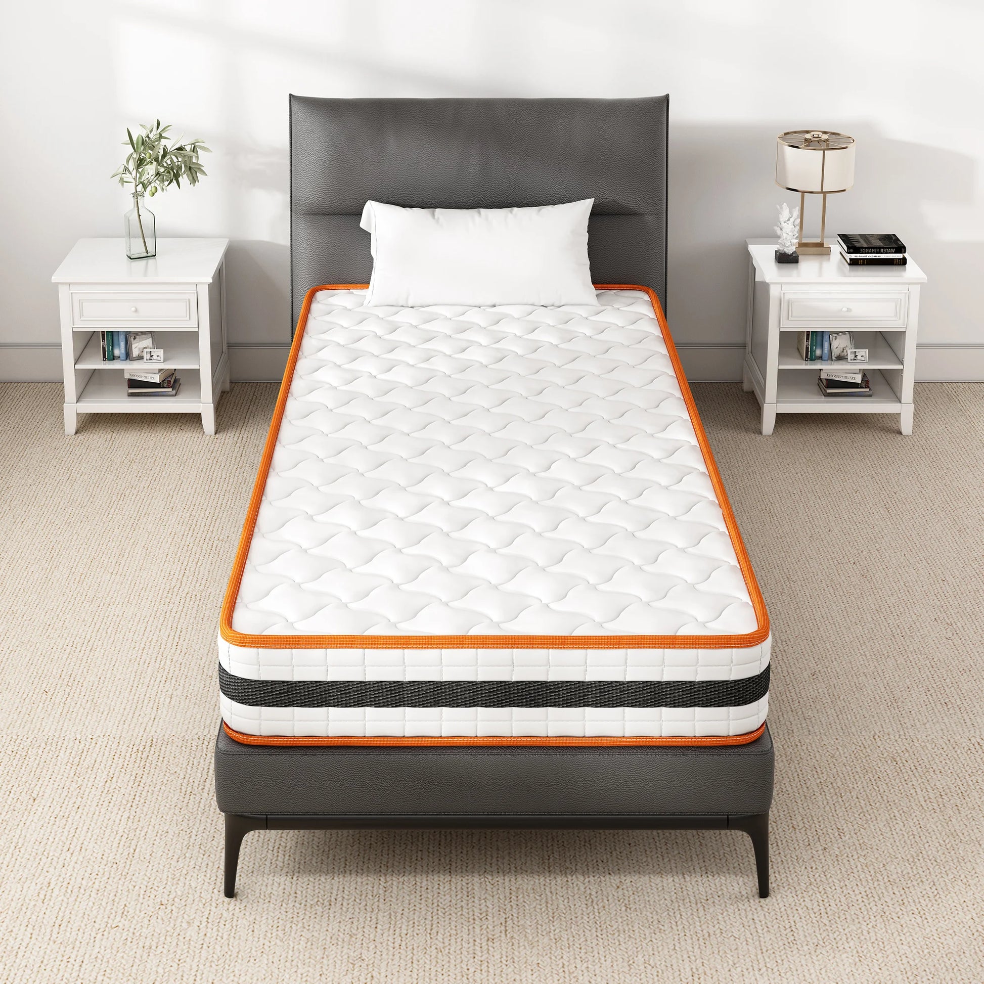 Mattress on a bed in a bedroom setting with white walls and furniture.