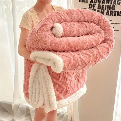 Person holding a pink textured blanket with white trim