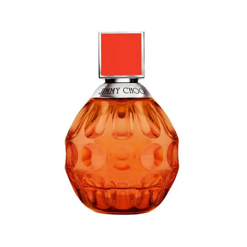 Orange perfume bottle with a red cap on a white background