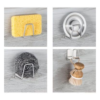 Set of four metal wall hooks holding a sponge, scrubber, and other cleaning tools on a wooden surface.
