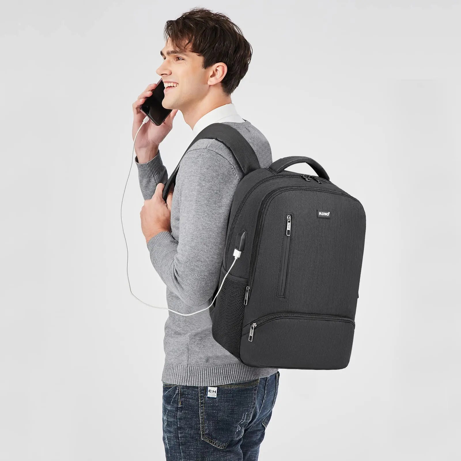 Man with a black backpack on a light gray background