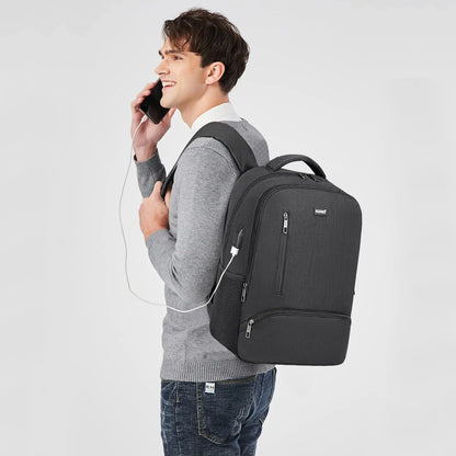 Man with a black backpack on a light gray background