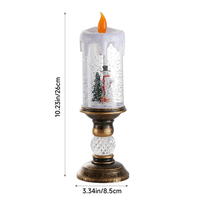 Decorative candle with a miniature scene inside a glass container, showing dimensions on a white background.
