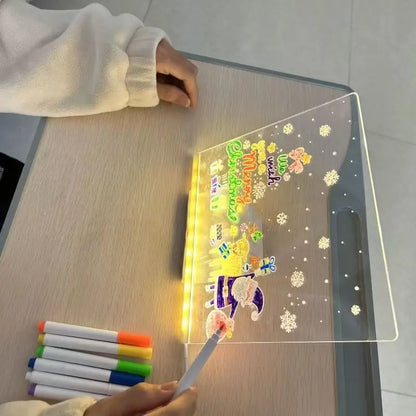 Person using a colorful marker on a transparent board with glowing text and graphics.