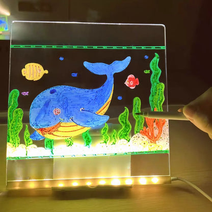 Colorful underwater scene with a whale on a transparent board, illuminated by LED lights.