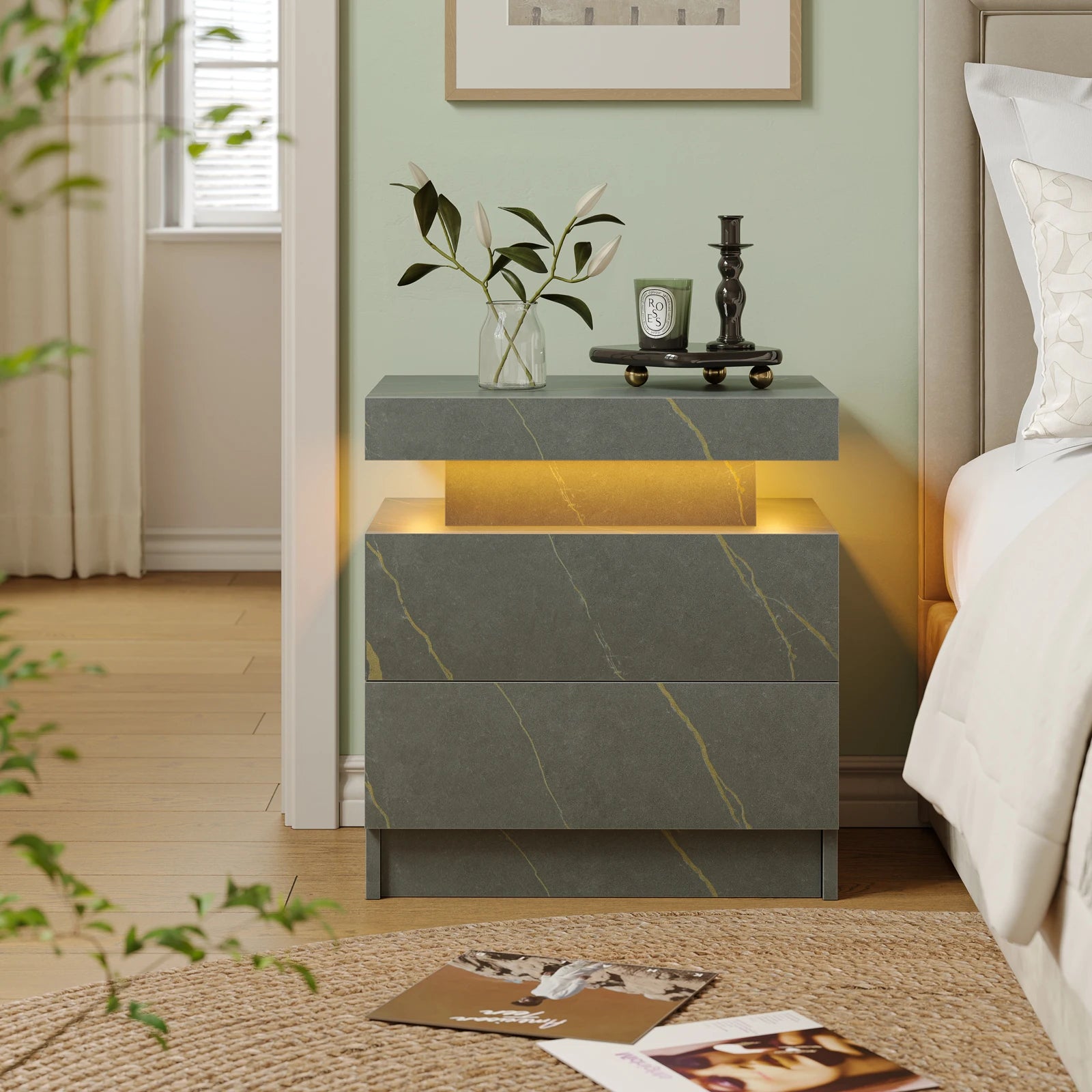 Gray marble nightstand with decorative items in a bedroom setting