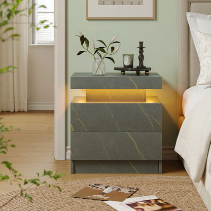 Gray marble nightstand with decorative items in a bedroom setting
