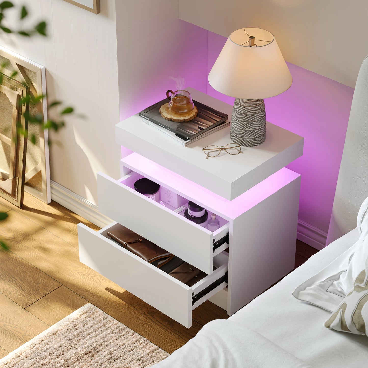 White nightstand with LED lighting in a bedroom setting