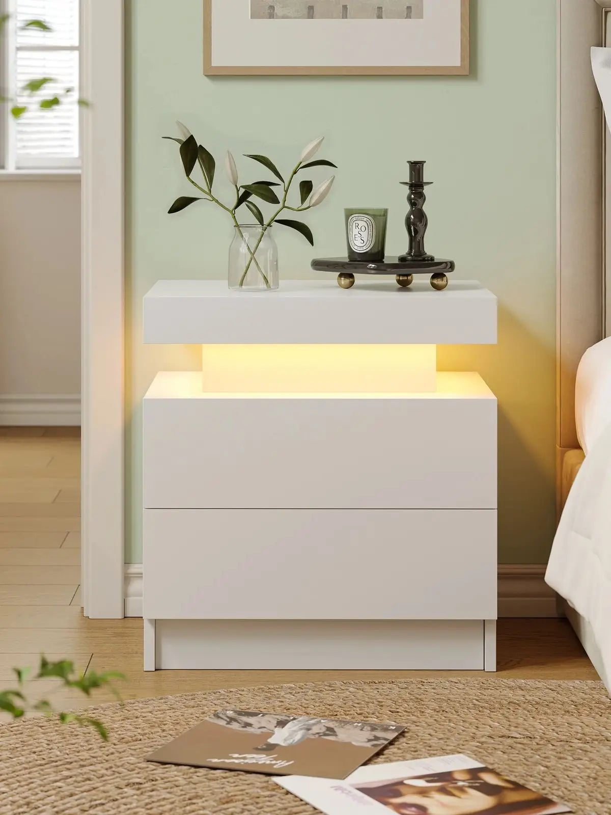 White nightstand with LED lighting in a bedroom setting