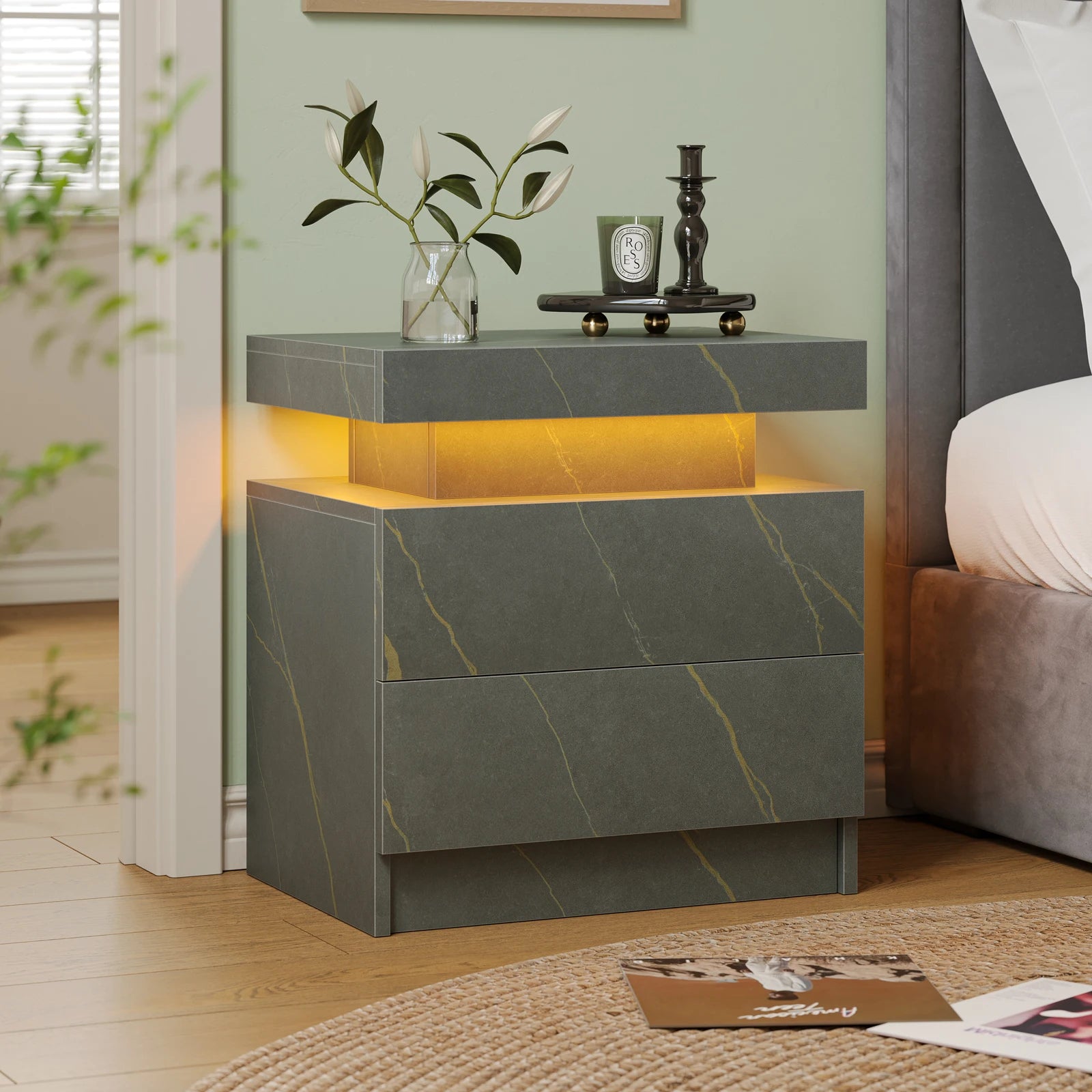 Modern nightstand with marble-like design and LED lighting in a bedroom setting.