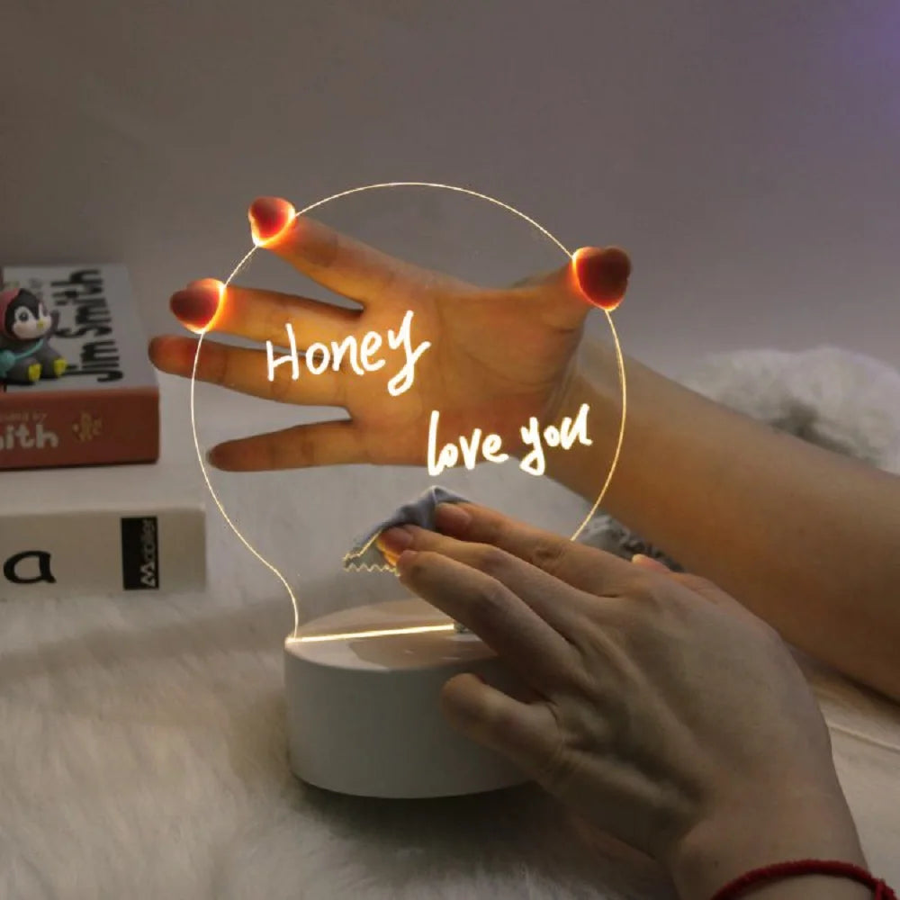 Neon light shaped like a hand with 'Honey love you' text on a wooden surface.