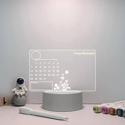 Desk lamp with digital calendar display on a light gray surface.