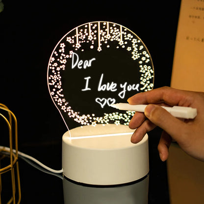 Hand writing on a light-up board with 'Dear I love you' text