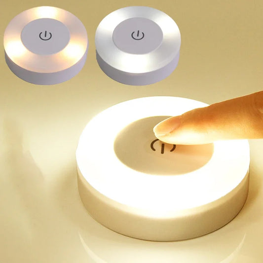 Round LED night light with power symbol on a beige background