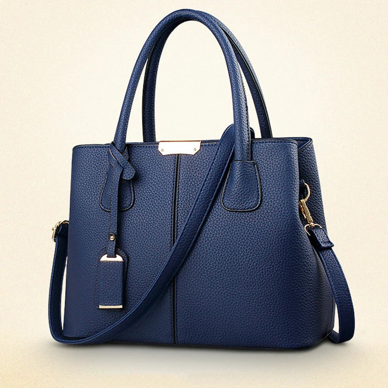 Blue handbag with a strap on a beige background