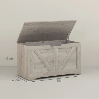 Wooden storage bench with open lid on a light gray background