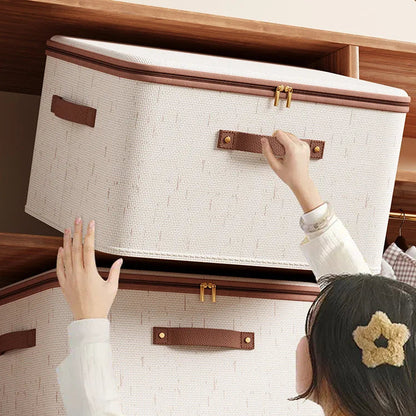 Person opening a large beige storage box with brown handles and trim.