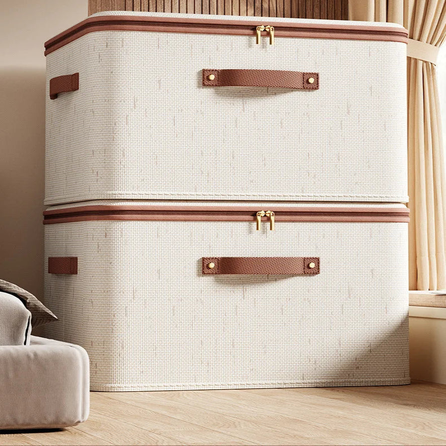 Large beige storage trunk with brown accents on a wooden floor.