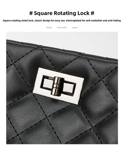 Black quilted handbag with a square rotating metal lock on a white background