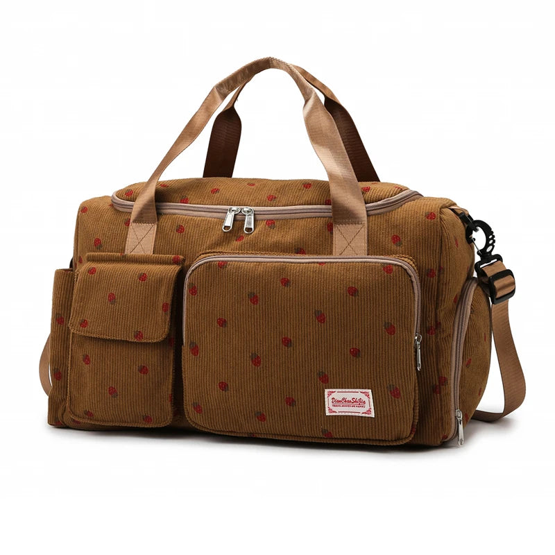Brown corduroy bag with red polka dots on a white background