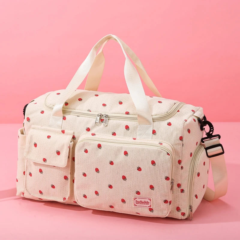 Pink polka dot bag with a strap on a pink background