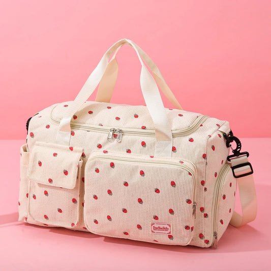 Pink polka dot bag with a strap on a pink background