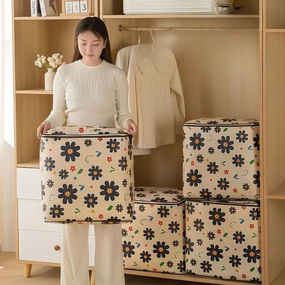 Woman holding a floral-patterned storage box in a room with shelves and clothes.