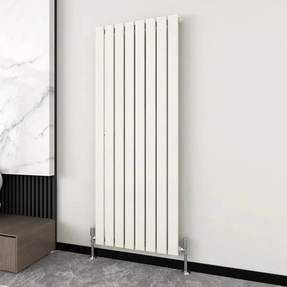 White vertical radiator on a gray wall with a marble-patterned floor.