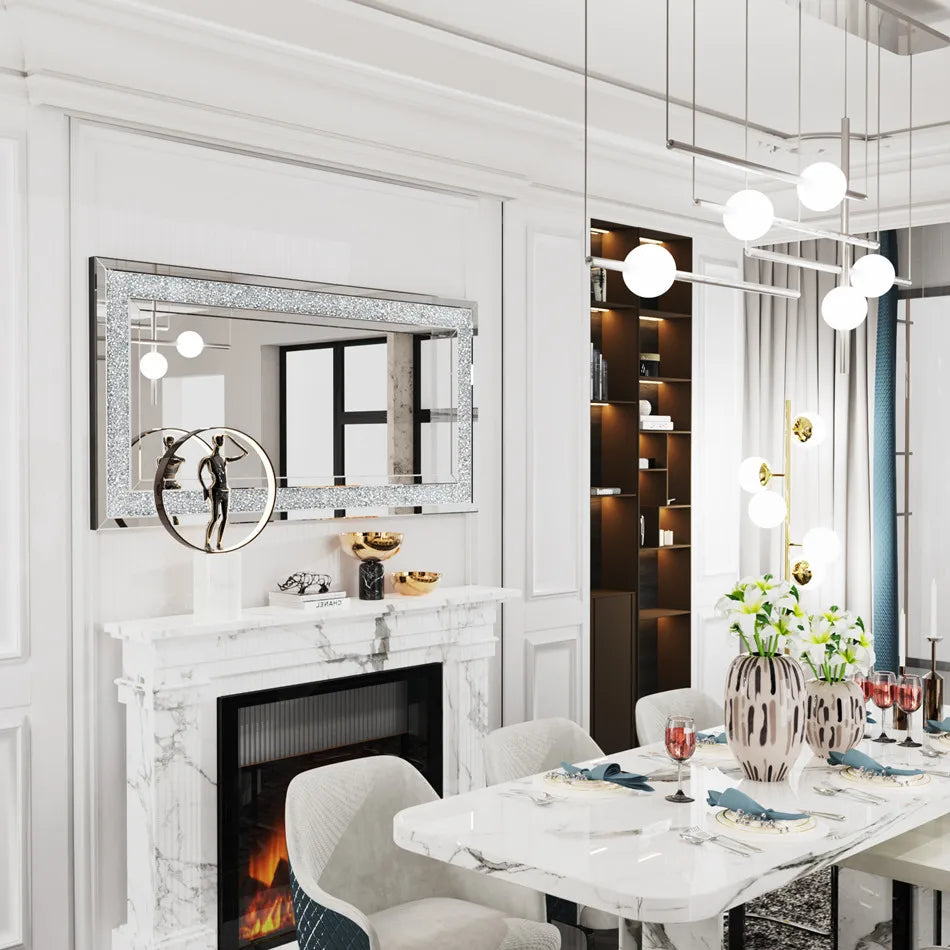 Modern dining room with marble fireplace, table setting, and decorative elements.