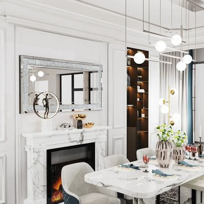 Modern dining room with marble fireplace, table setting, and decorative elements.