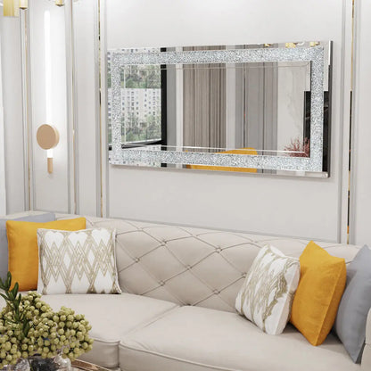 Gray sofa with colorful cushions in a living room setting, featuring a decorative mirror.