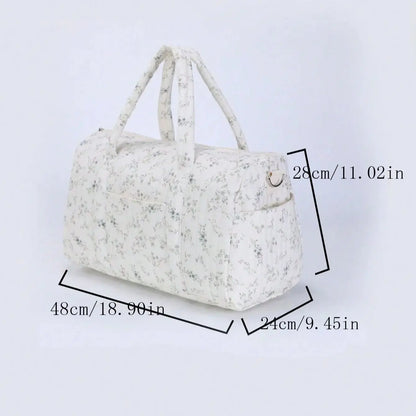 White floral-patterned handbag with measurements on a light gray background