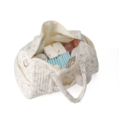 Floral-patterned bag with toiletries on a white background