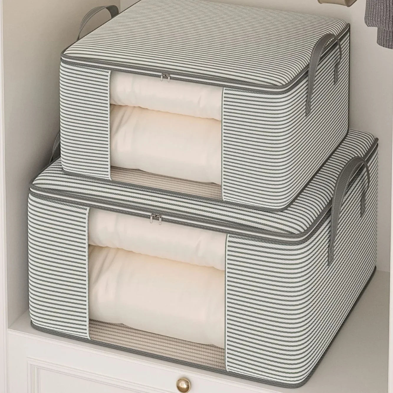 Two striped storage bags with zippers on a light background